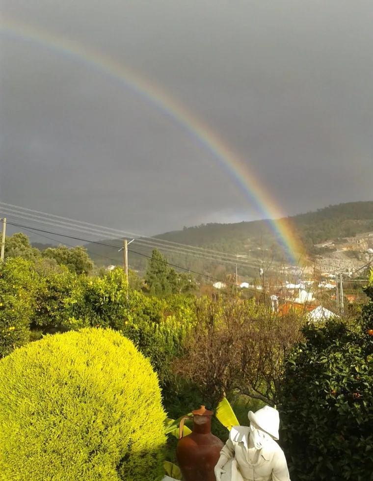 Rainbow over the green hills of Monchique